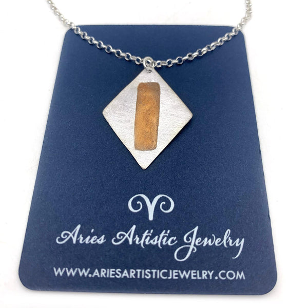 Sterling Silver Diamond Shaped Pendant with Copper Accents