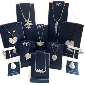 Uses a wonderful mix of materials including fine and sterling silver, raw gemstones, freshwater pearls and leather.  Custom pieces, bridal jewelry & treasured mementos