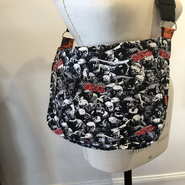 Walking Dead Cross-body Messenger Bag, fully reversible with a total of 12 pockets and adjustable strap.  Pop-culture, Star Wars, Star Trek, Walking Dead, Wonder Woman, Vintage Steampunk and flowered patterns.