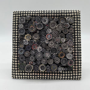 checkered frame with rolled magazines created by Trash Art Treasures