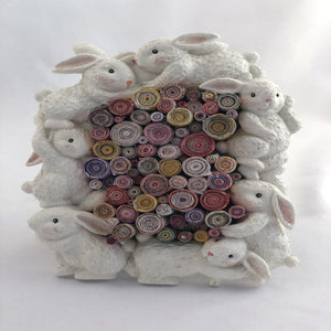 Bunny frame with multi colored rolled magazines created by Trash Art Treasures