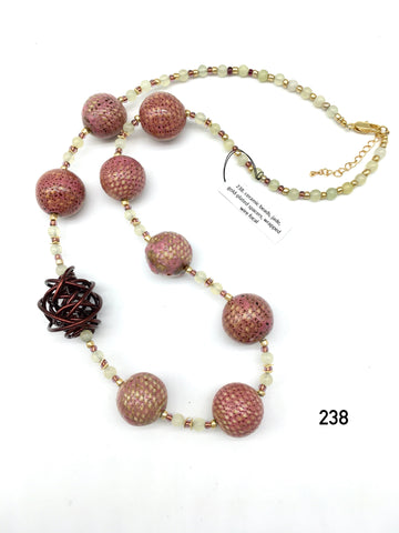 Ceramic beads, jade, gold-plated spacers, wrapped wire focal