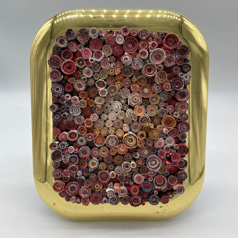 Gold frame with pink rolled magazines created by Trash Art Treasures