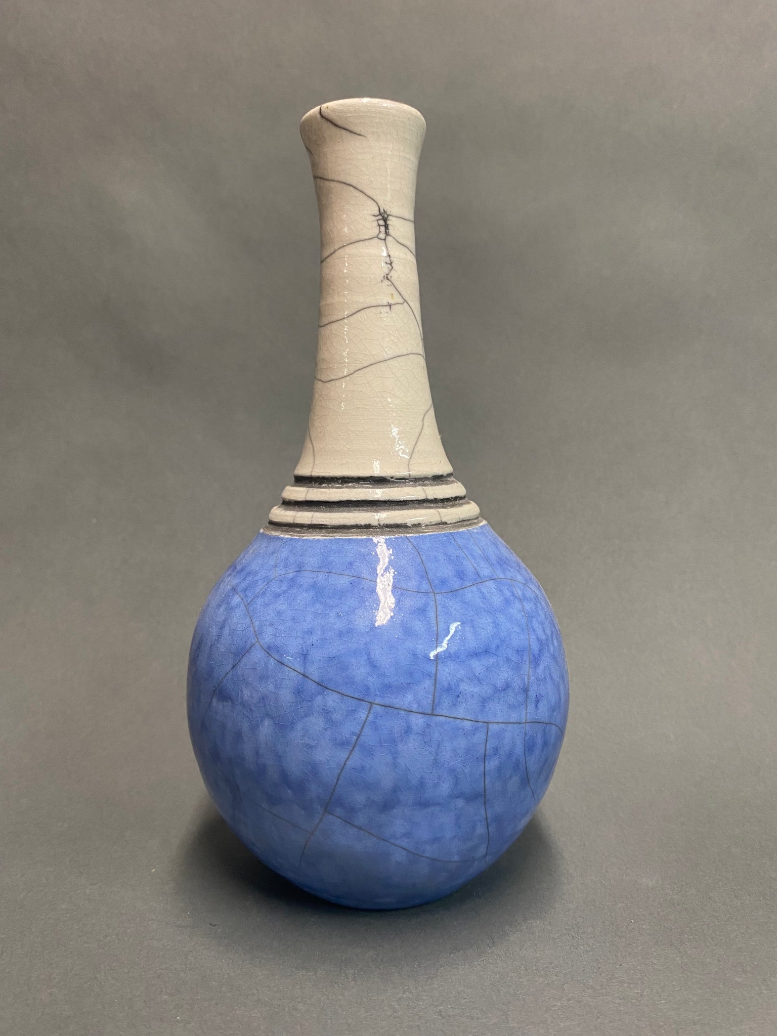 white stoneware blue engine carved raku fired ceramic vase created by Jane Kleiman