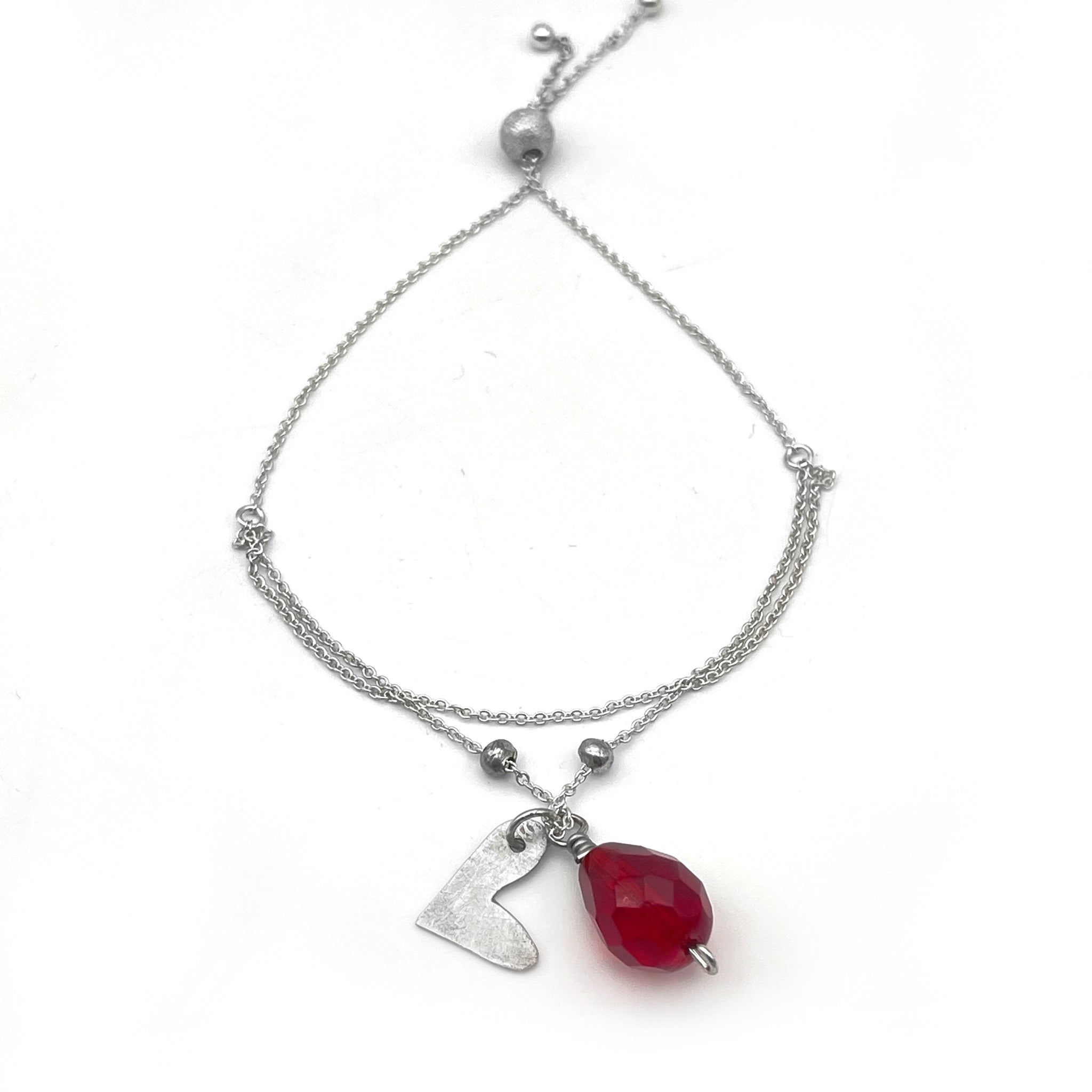 Sterling Silver Adjustable Bracelet with Whimsical Heart and Red Crystal Charm